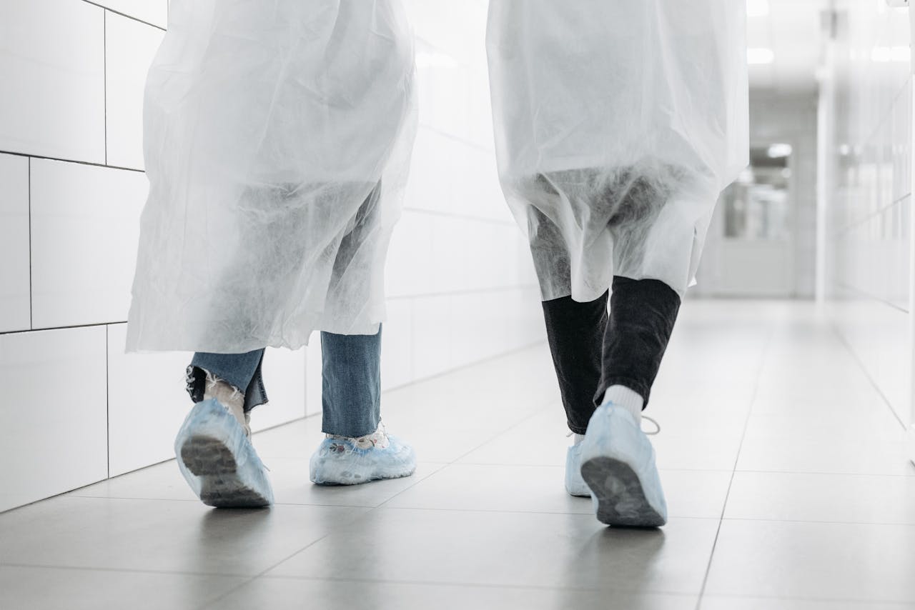 Man and Woman Wearing Lab Coats